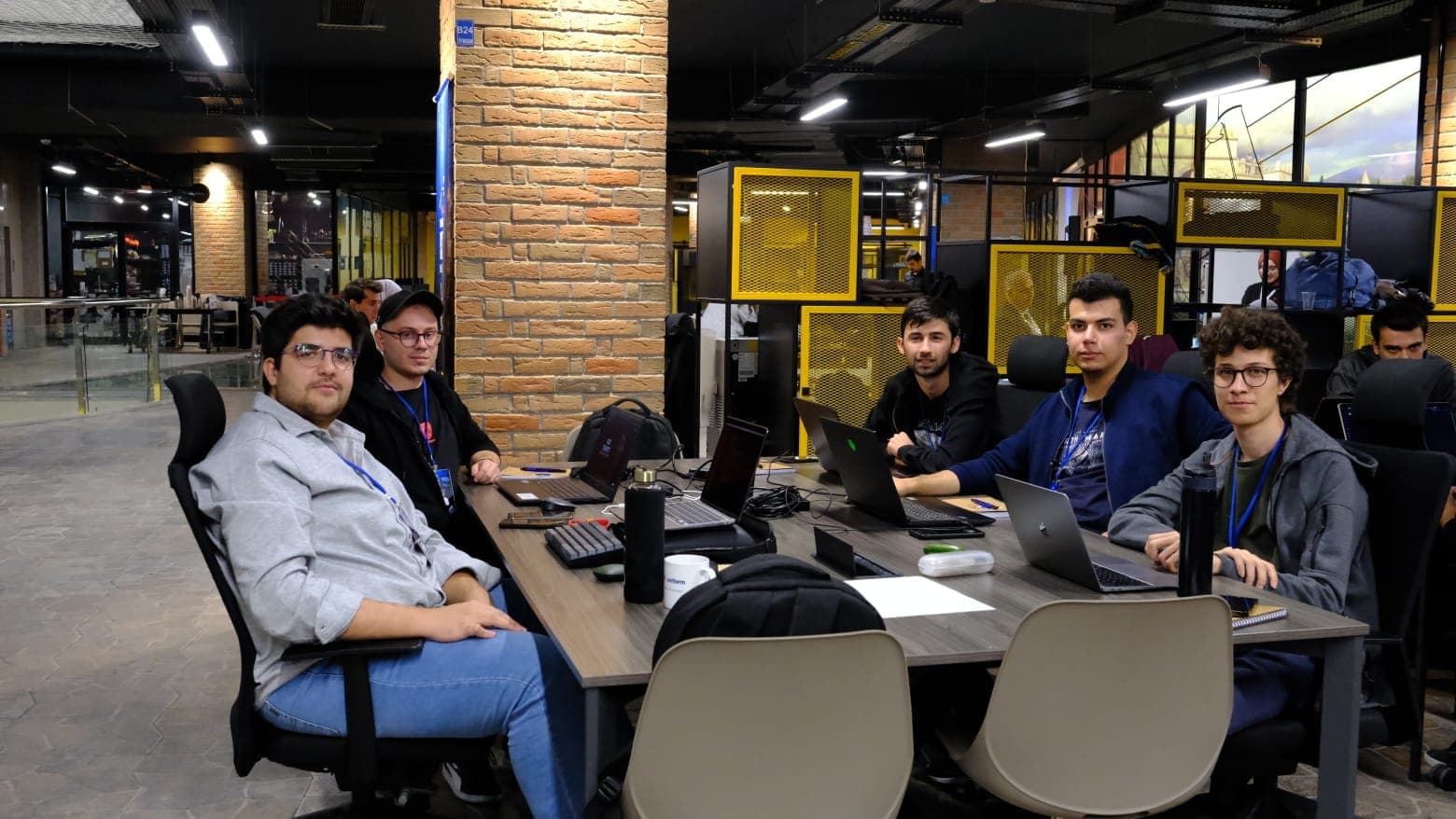 A shared coding session with friends around a table